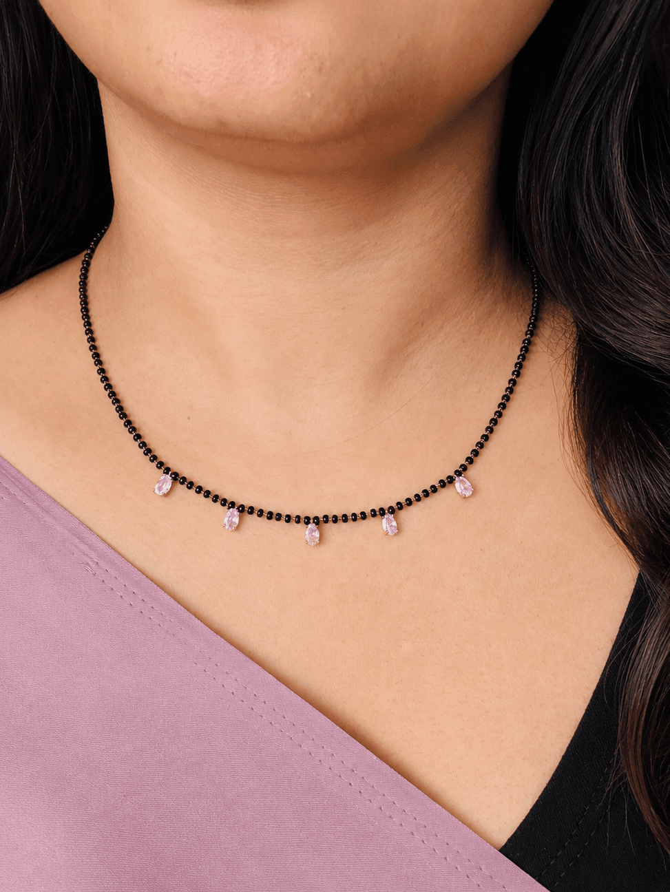 Elegant black beaded necklace with pink gemstone drops, perfect for South Indian bridal or temple wear.